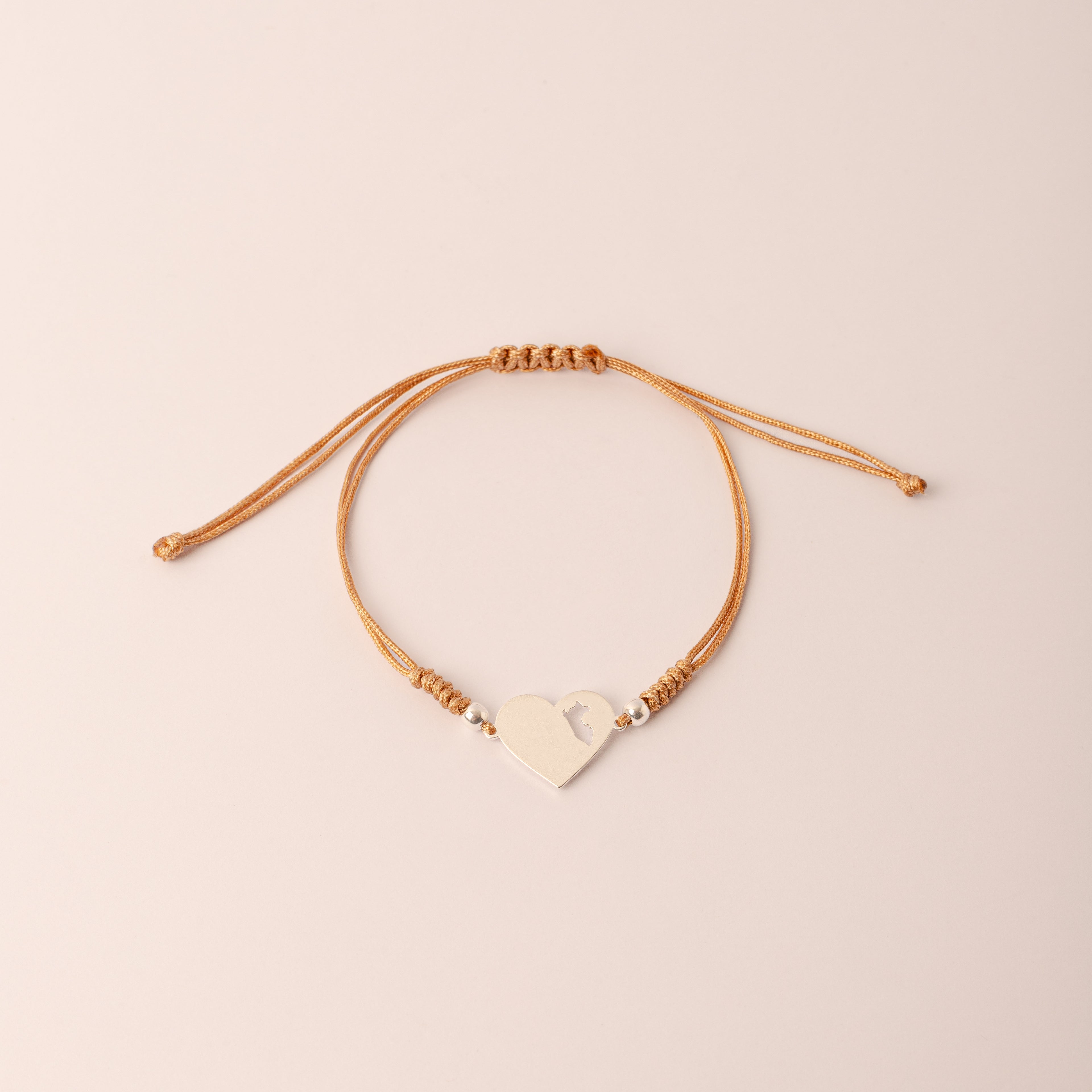 Pulsera Lia Snake Beige - Corazón mapa del Perú calado