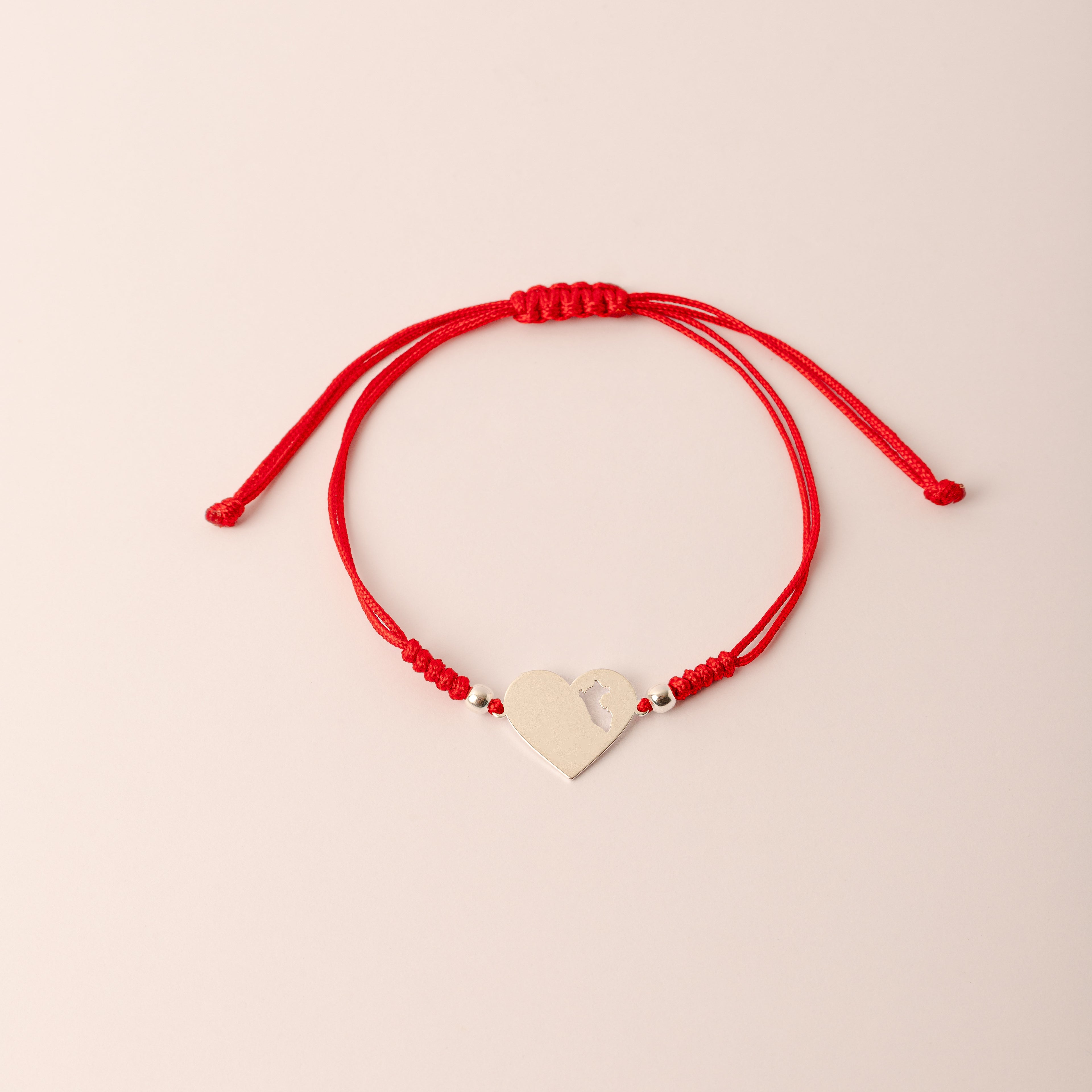 Pulsera Lia Snake rojo - Corazón mapa del Perú calado *